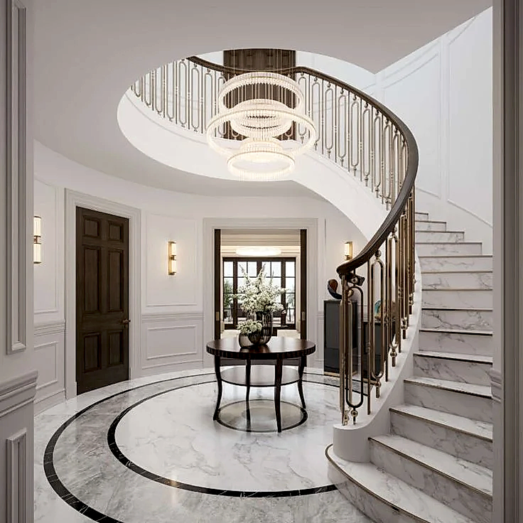 Mermer döşeli yuvarlak holde dairesel siyah bordürle tanımlanmış merkez alan